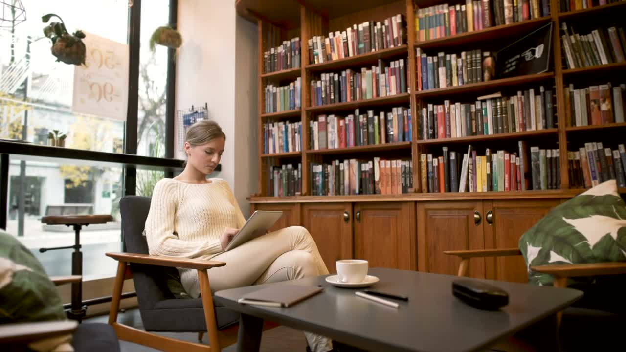 Free Stock Video Woman Using A Tablet By The Window Live Wallpaper