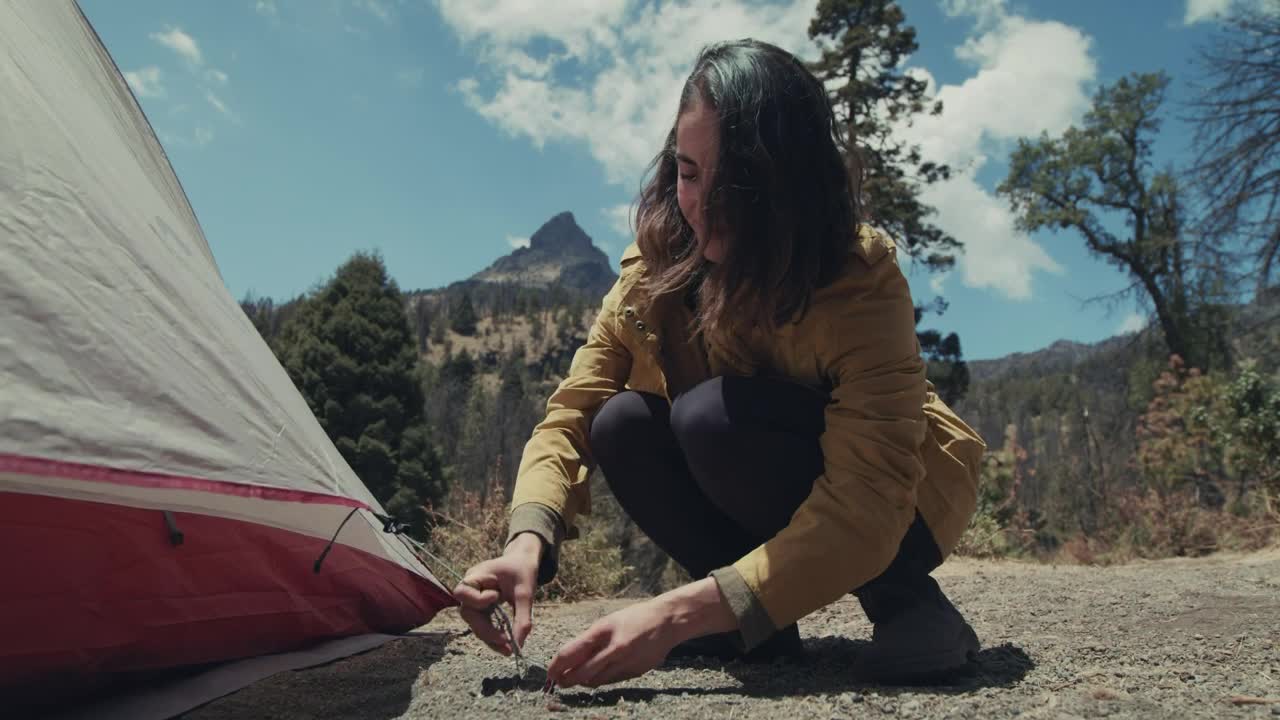 Free Stock Video Woman Tying Her Tent To A Nail Live Wallpaper