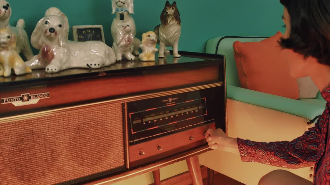 Free Stock Video Woman Turning On An Old Radio Live Wallpaper