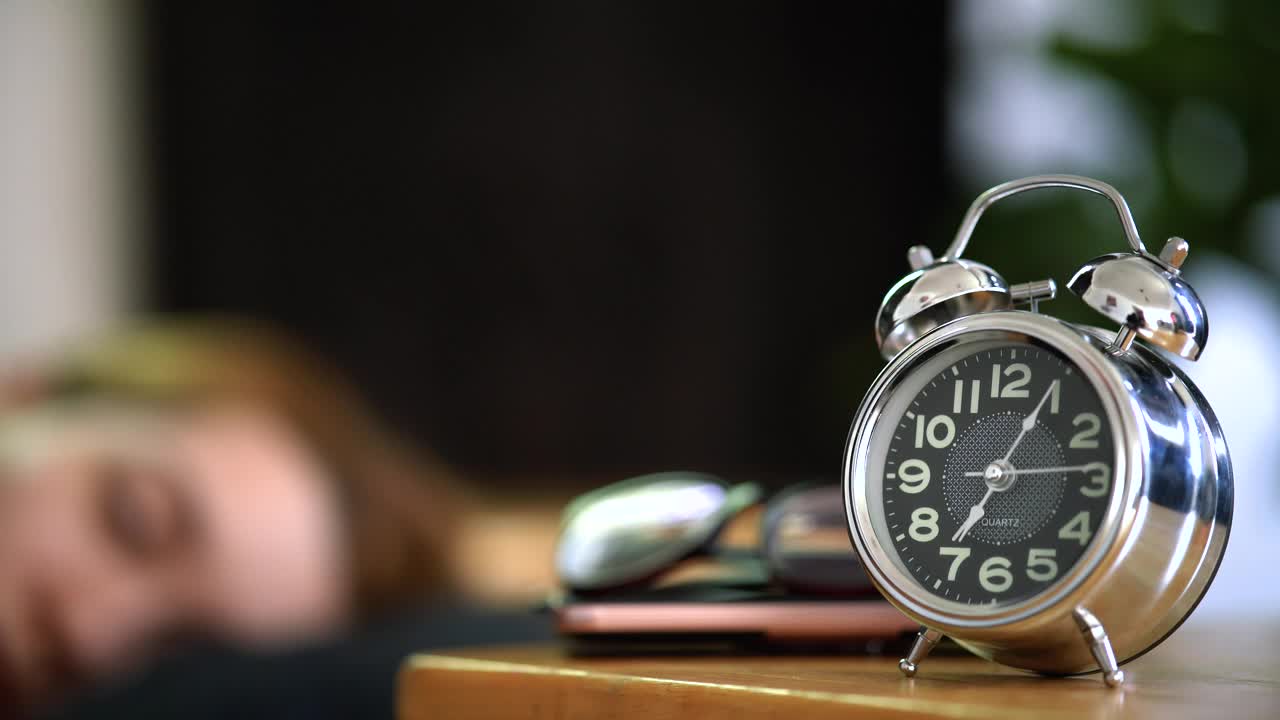 Free Stock Video Woman Turning Off Her Alarm Clock In The Morning Live Wallpaper