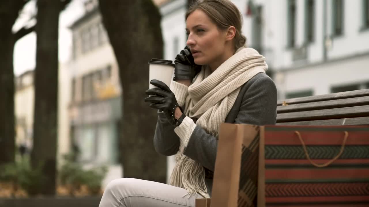 Free Stock Video Woman Talking On The Phone On A Public Bench Live Wallpaper