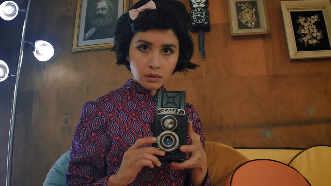 Free Stock Video Woman Taking A Photo With An Old Camera Live Wallpaper