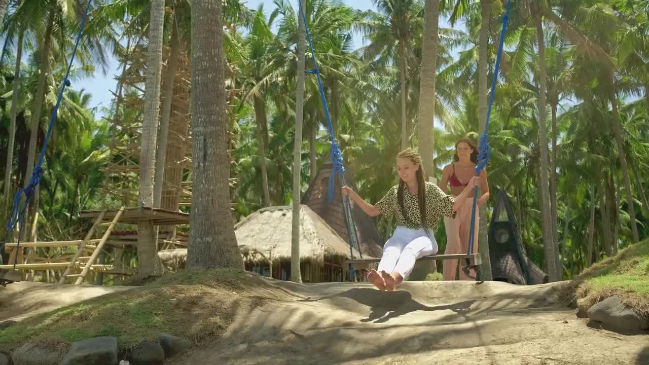 Free Stock Video Woman Swinging Her Friend On The Beach Live Wallpaper