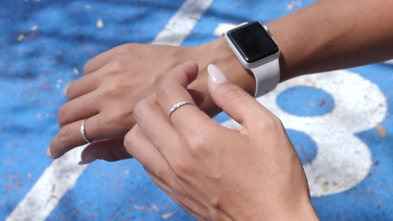 Free Stock Video Woman Starting Her Stopwatch Before Running Live Wallpaper