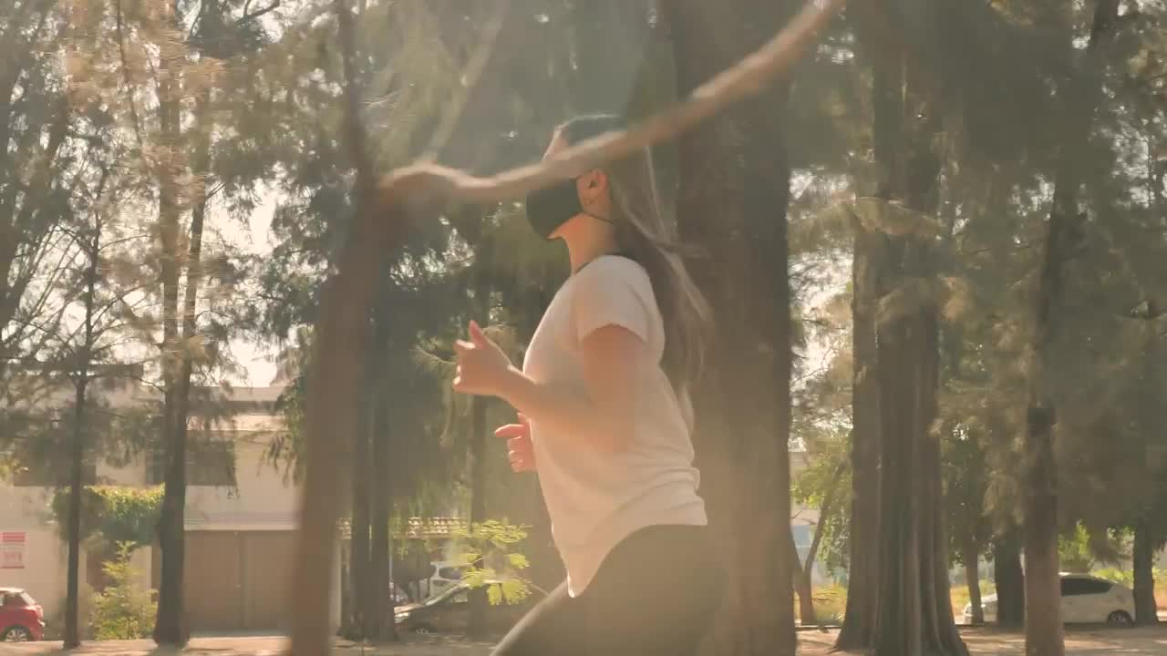 Free Stock Video Woman Running With Face Mask In A Park Live Wallpaper
