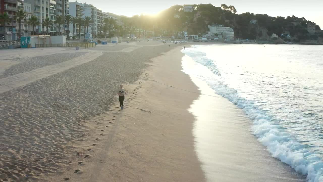 Free Stock Video Woman Running On The Seashore Aerial Shot Live Wallpaper