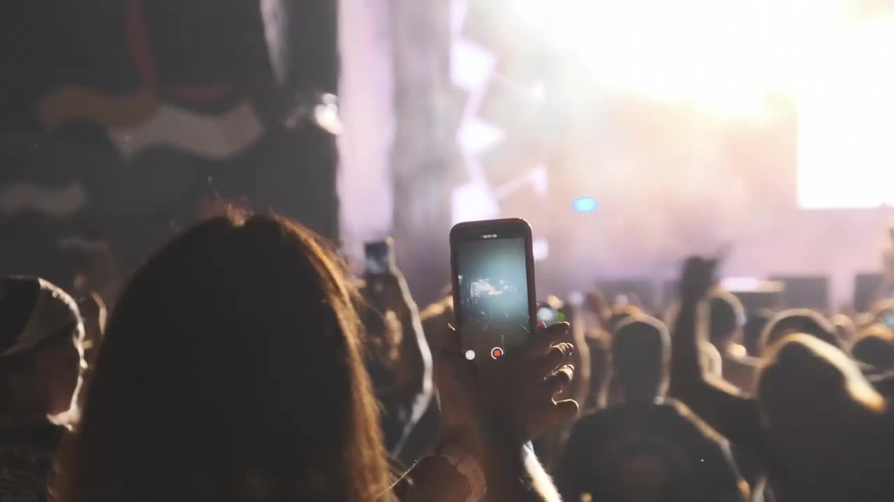 Free Stock Video Woman Recording A Concert With Her Smartphone Live Wallpaper
