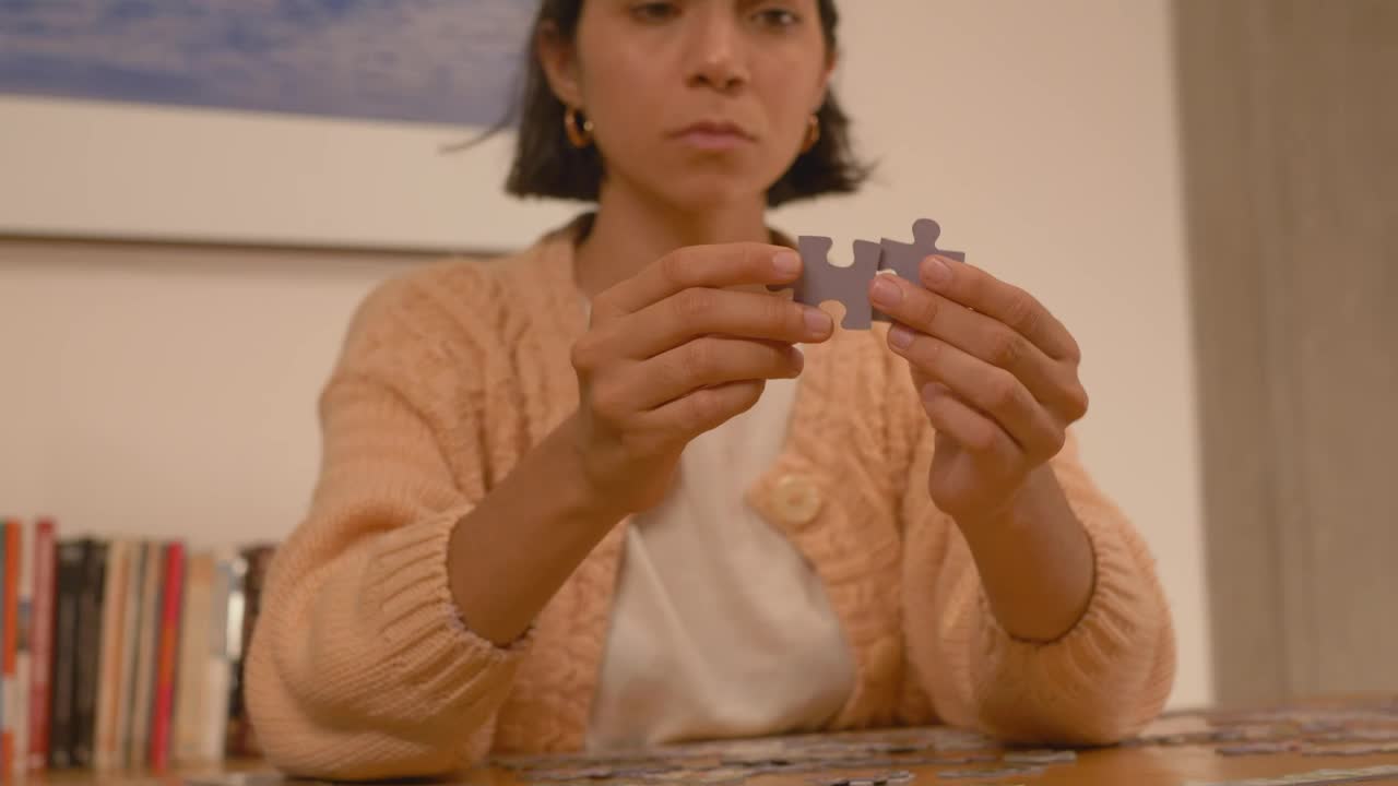 Free Stock Video Woman Putting Puzzle Pieces Together Live Wallpaper