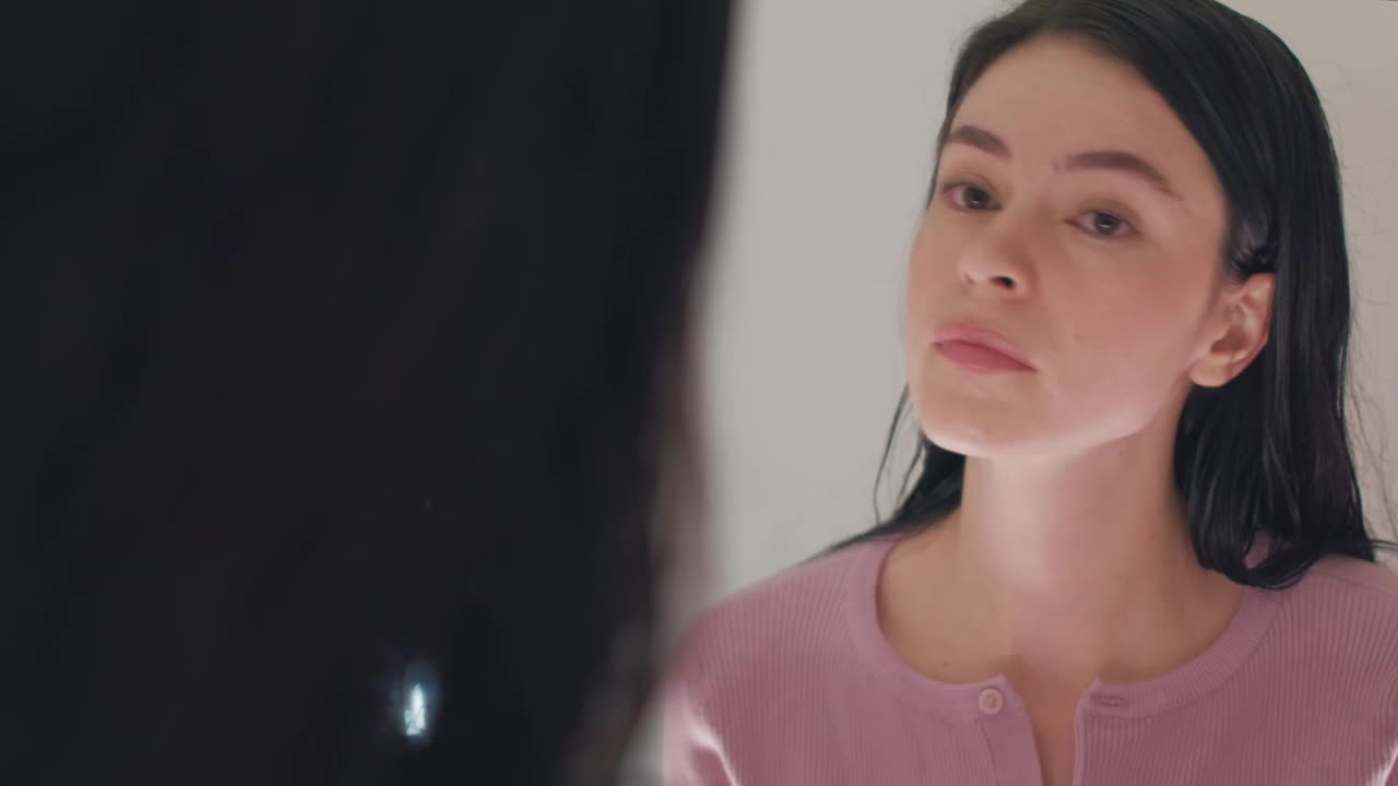 Free Stock Video Woman Putting On Her Earrings In Front Of The Mirror Live Wallpaper