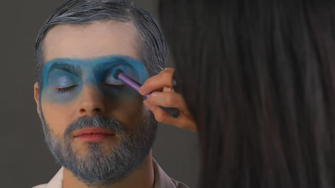 Free Stock Video Woman Putting Makeup On A Man With A Winter Style Live Wallpaper