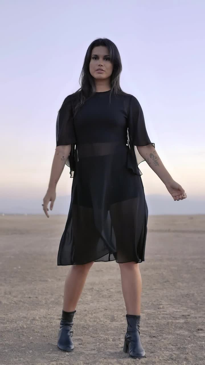 Free Stock Video Woman Posing For The Camera In The Middle Of A Live Wallpaper