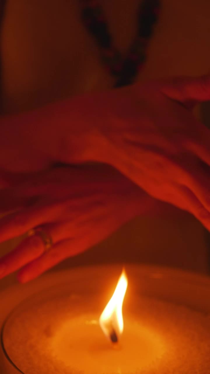 Free Stock Video Woman Passing Her Hands Near The Flame Of A Candle Live Wallpaper