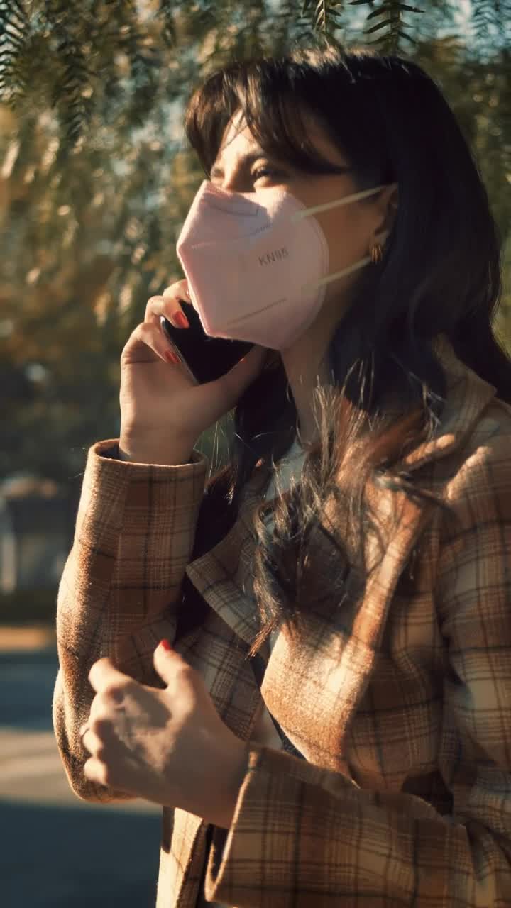 Free Stock Video Woman On The Phone Wearing Mask Live Wallpaper