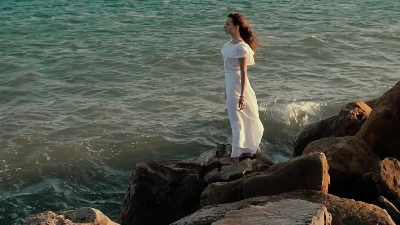 Free Stock Video Woman In White Dress Looking Out To Sea Live Wallpaper
