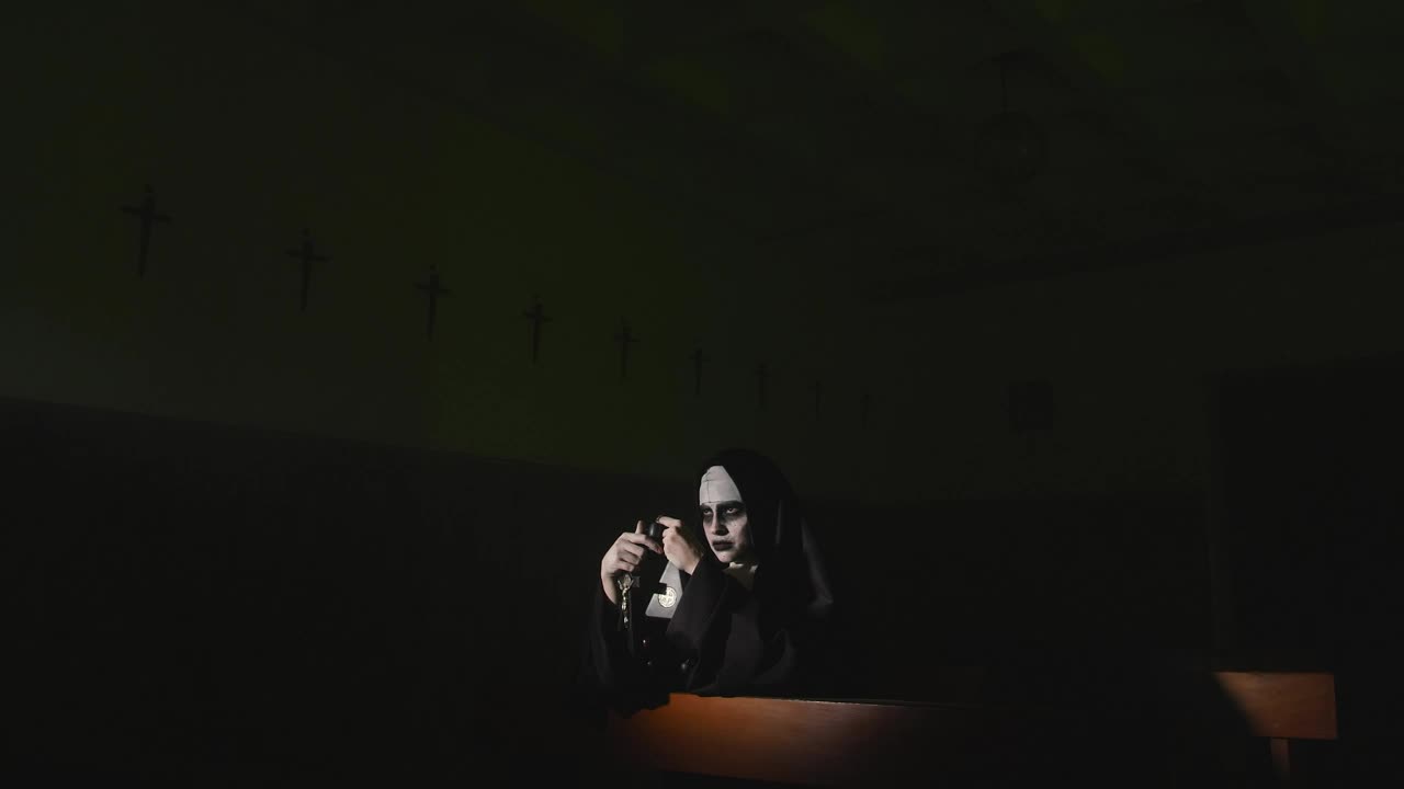 Free Stock Video Woman In Nun Costume On Halloween Praying In Church Live Wallpaper