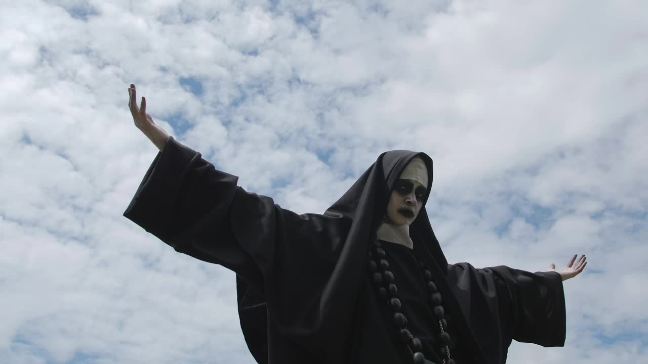 Free Stock Video Woman In Nun Costume On A Cloudy Day Live Wallpaper