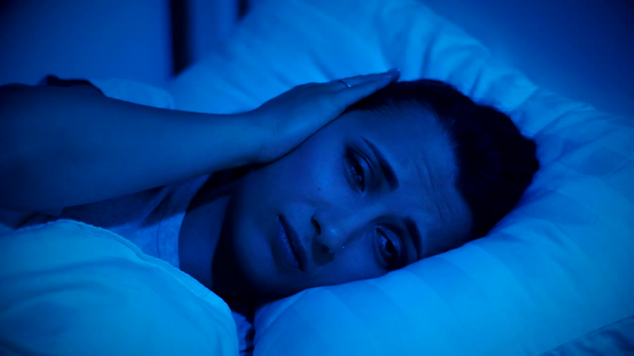 Free Stock Video Woman In Her Bed Unable To Sleep Due To The Live Wallpaper