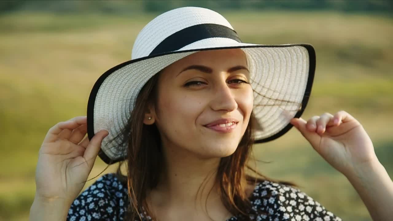 Free Stock Video Woman Holding Her Hat In A Meadow Live Wallpaper
