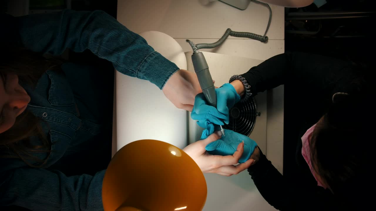 Free Stock Video Woman Filing A Girls Nails In A Manicure Session Live Wallpaper