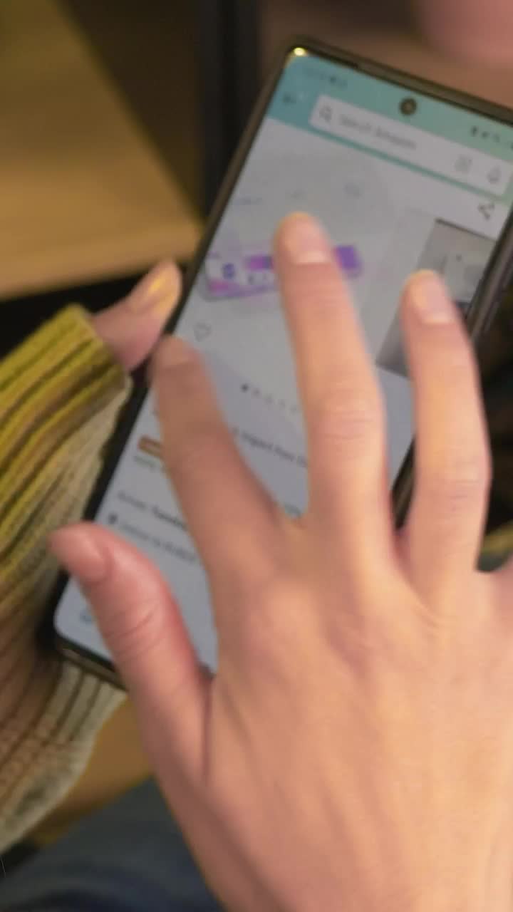Free Stock Video Woman Exploring An Online Sales Page On Her Cell Phone Live Wallpaper