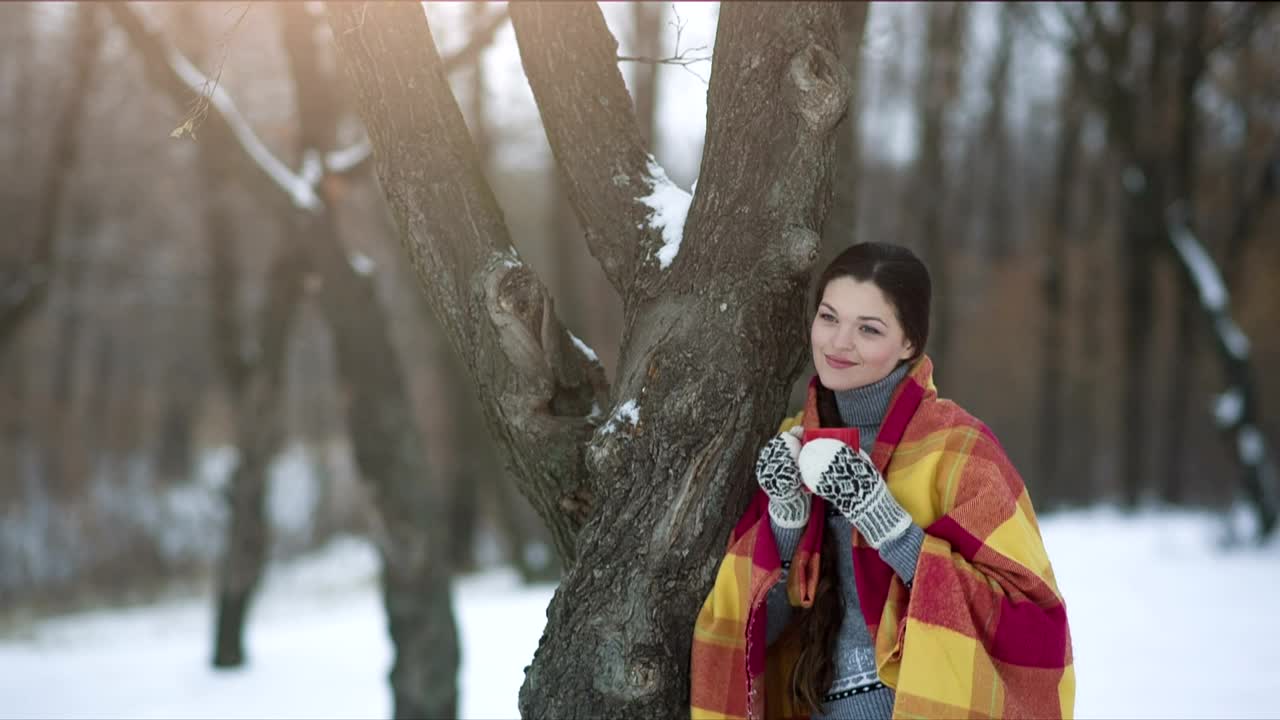 Free Stock Video Woman Enjoying A Hot Drink In The Winter Forest Live Wallpaper