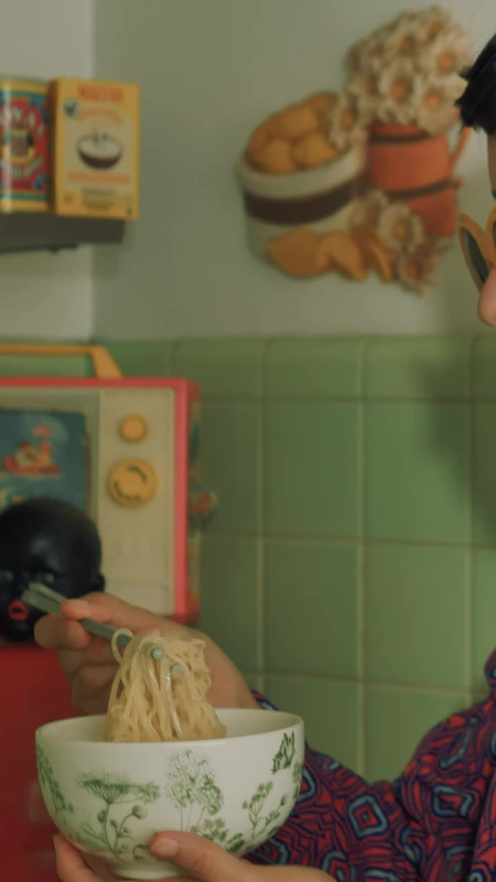 Free Stock Video Woman Eating Noodles In The Kitchen Live Wallpaper