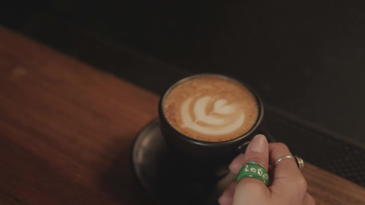 Free Stock Video Woman Drinking From A Cup Of Frothy Coffee Live Wallpaper