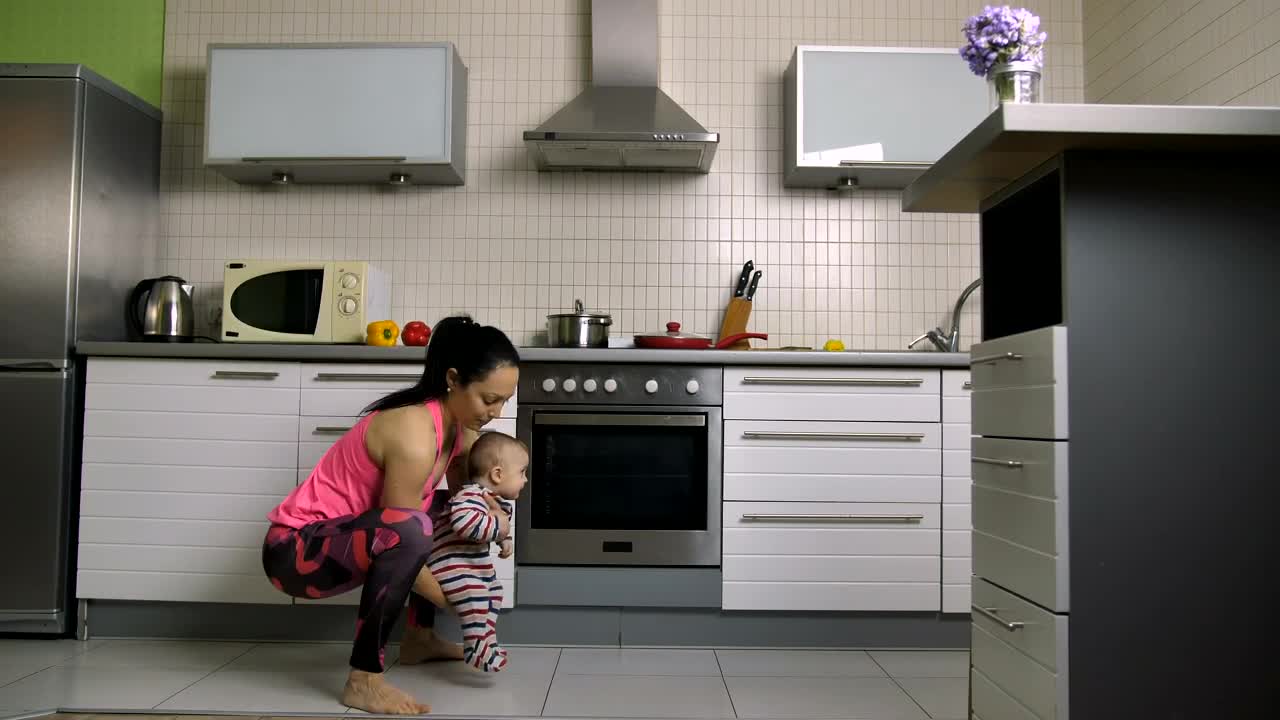 Free Stock Video Woman Doing Squats With Her Baby In Arms Live Wallpaper