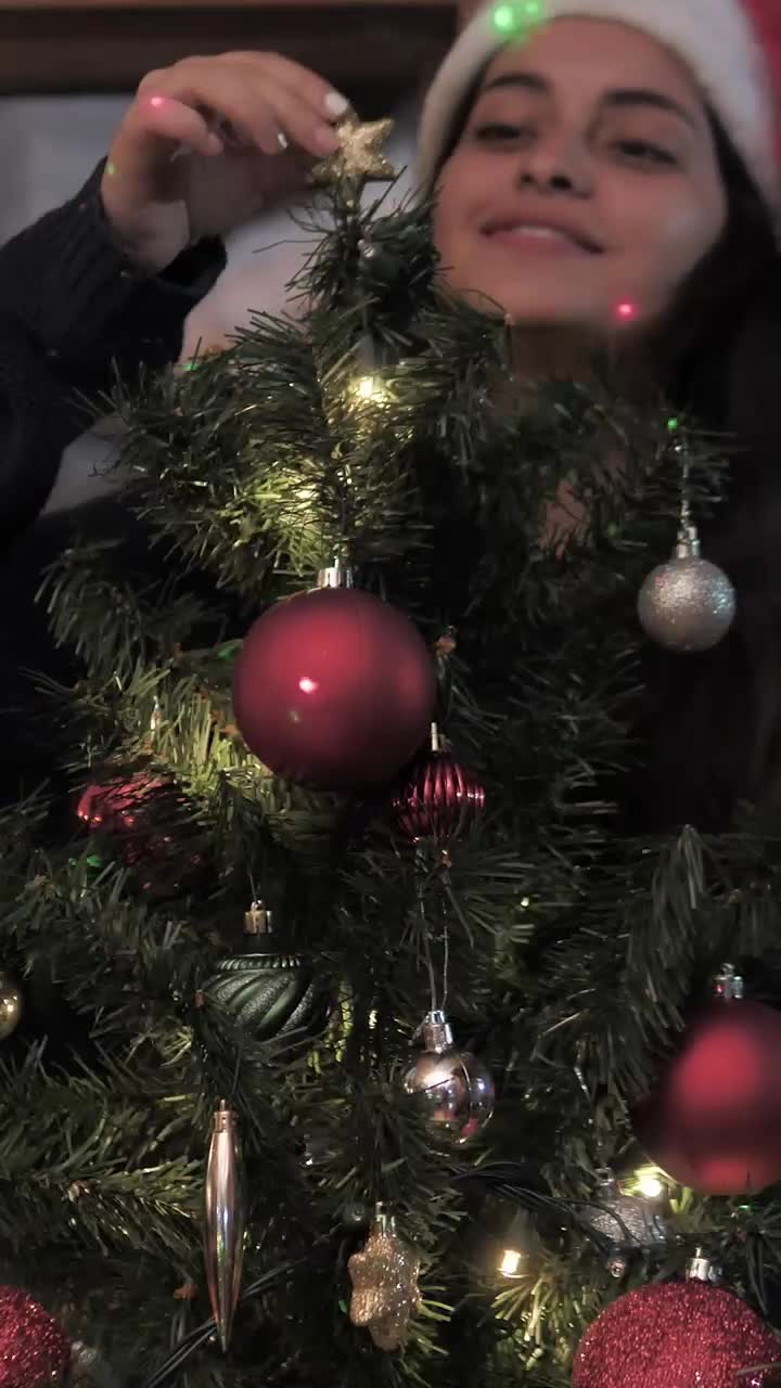 Free Stock Video Woman Decorates Christmas Tree At Home Live Wallpaper