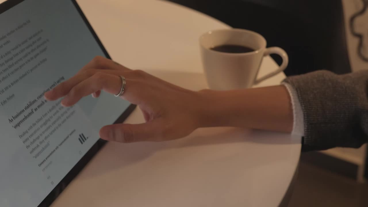 Free Stock Video Woman Browsing A News Page On A Tablet Live Wallpaper