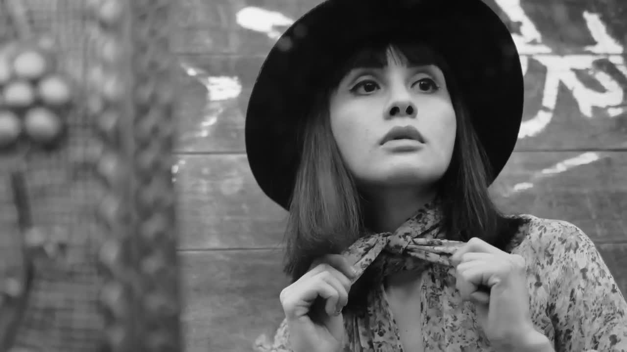 Free Stock Video Woman Adjusting Her Neck Scarf In Black And White Live Wallpaper