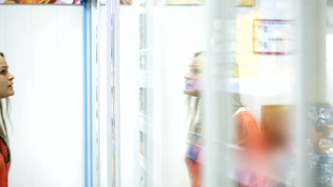   Stock Footage Woman Choosing A Cosmetic Product Live Wallpaper