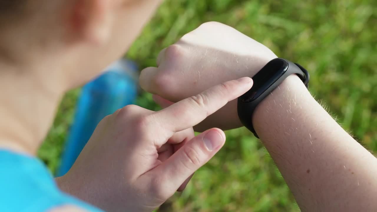   Stock Footage Woman Checking Her Fitness Gadget Live Wallpaper