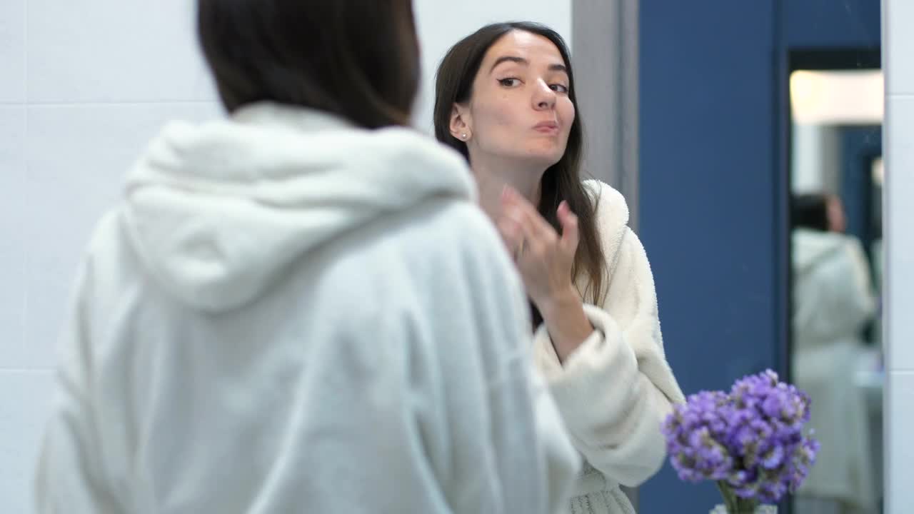   Stock Footage Woman Checking Her Face In The Mirror Live Wallpaper
