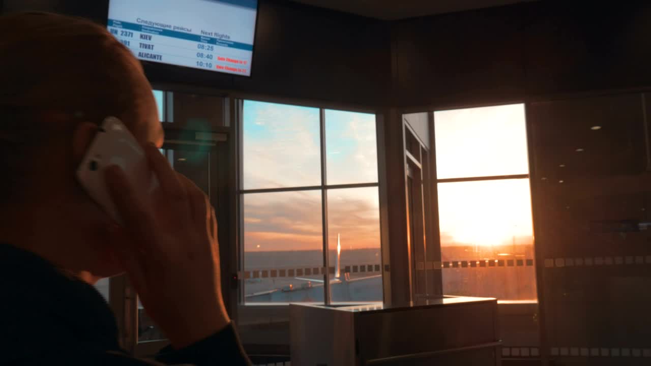   Stock Footage Woman Chatting While Waiting For A Flight To Leave Live Wallpaper