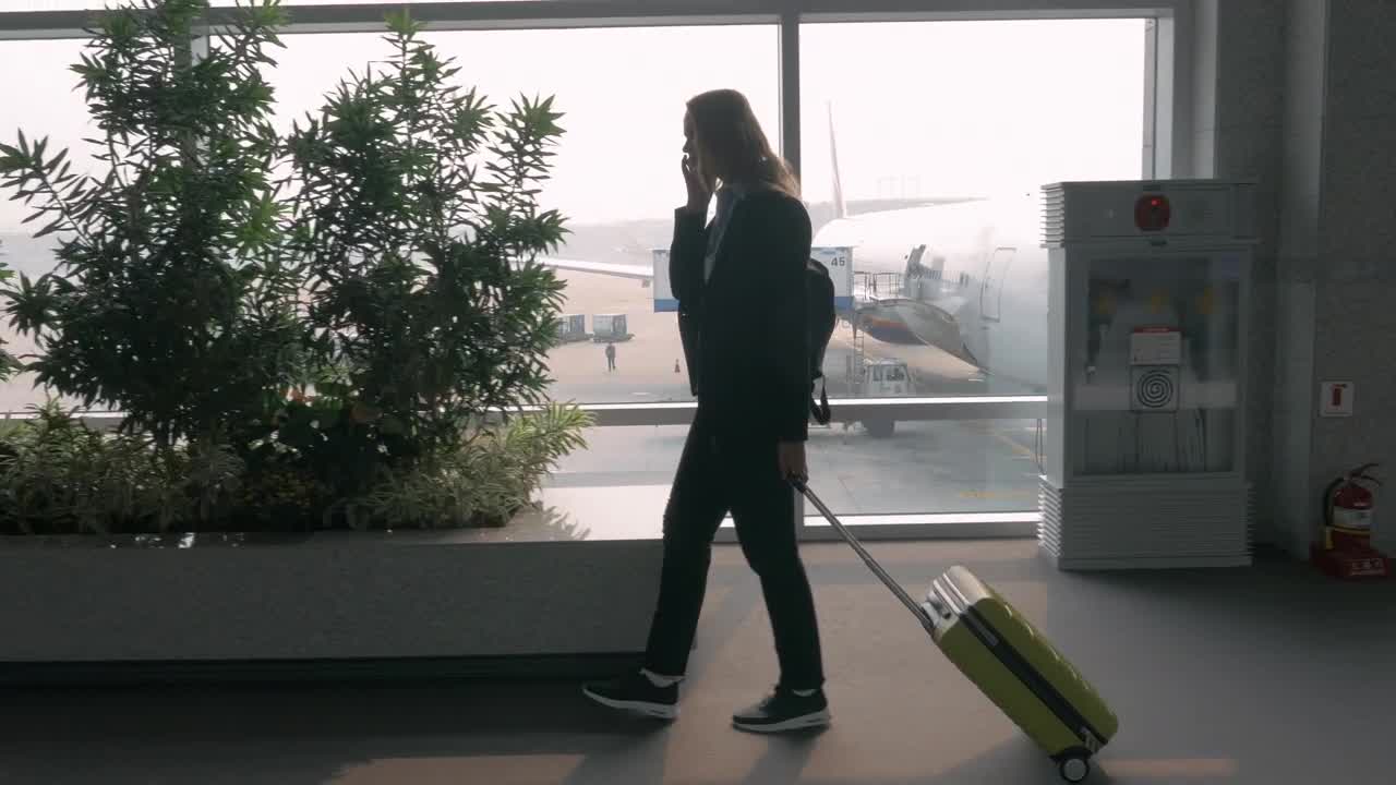  Stock Footage Woman Chatting On The Phone At An Airport Live Wallpaper