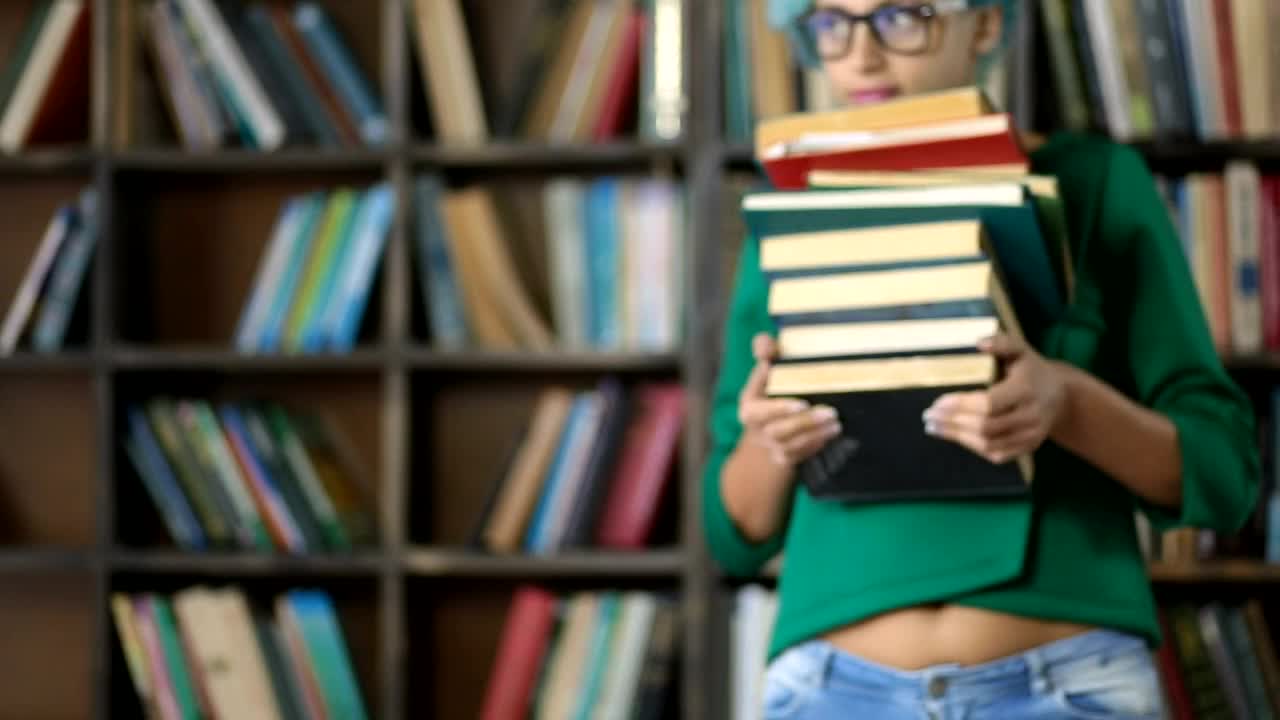   Stock Footage Woman Carrying A Lot Of Books Live Wallpaper