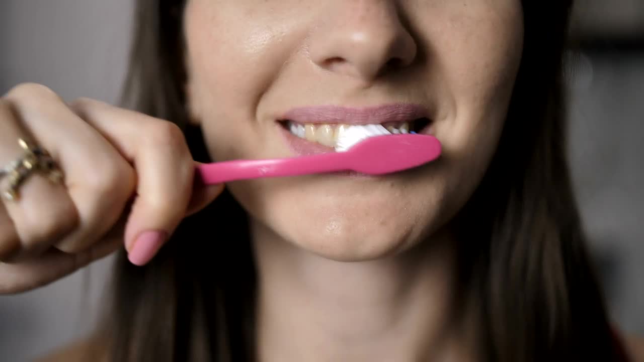   Stock Footage Woman Brushing Her Teeth In The Morning Live Wallpaper