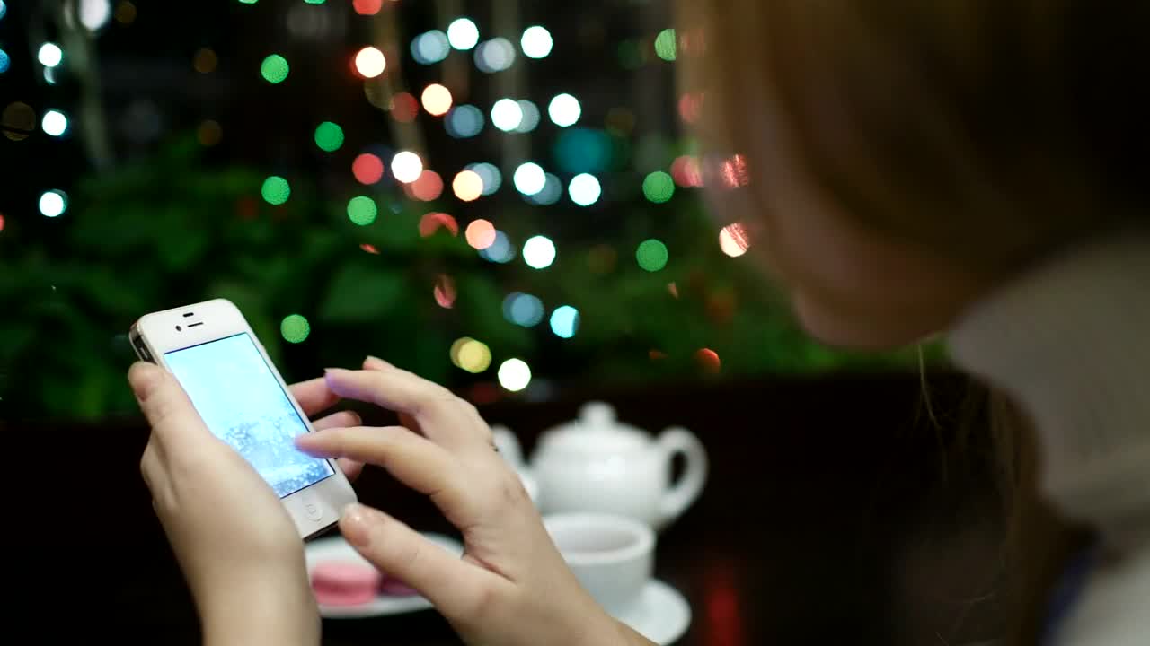   Stock Footage Woman Browsing Photos In A Cafe Live Wallpaper