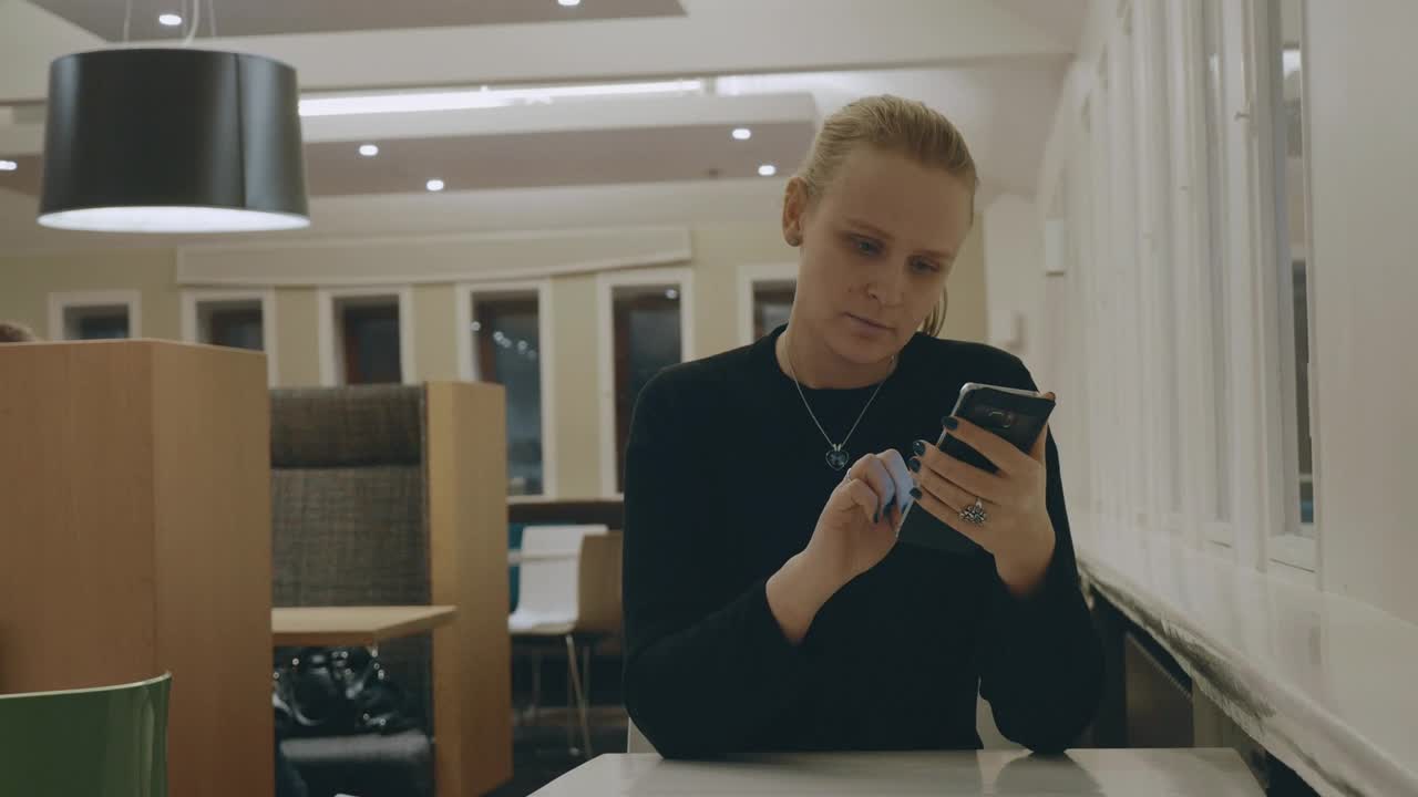   Stock Footage Woman Browsing Her Phone In A Hotel Live Wallpaper