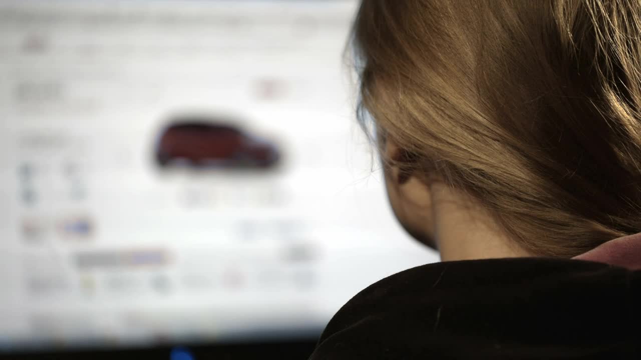   Stock Footage Woman Browsing Cars Online Live Wallpaper