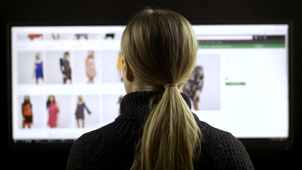   Stock Footage Woman Browsing A Fashion Website Back View Live Wallpaper