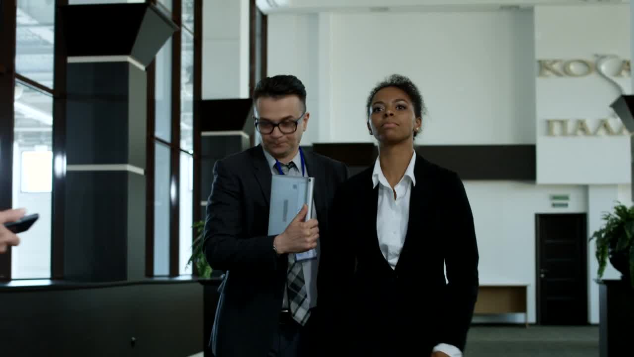   Stock Footage Woman Avoiding Journalists In The Hallway Live Wallpaper