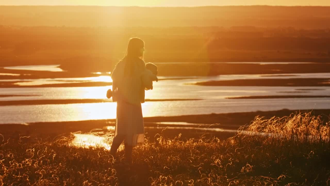   Stock Footage Woman And Her Baby Spinning At Sunset Live Wallpaper
