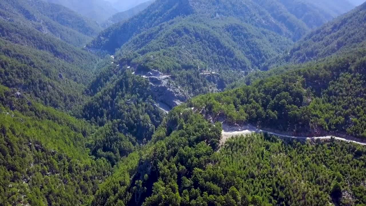   Stock Footage Winding Road Through A Mountain Forest Live Wallpaper