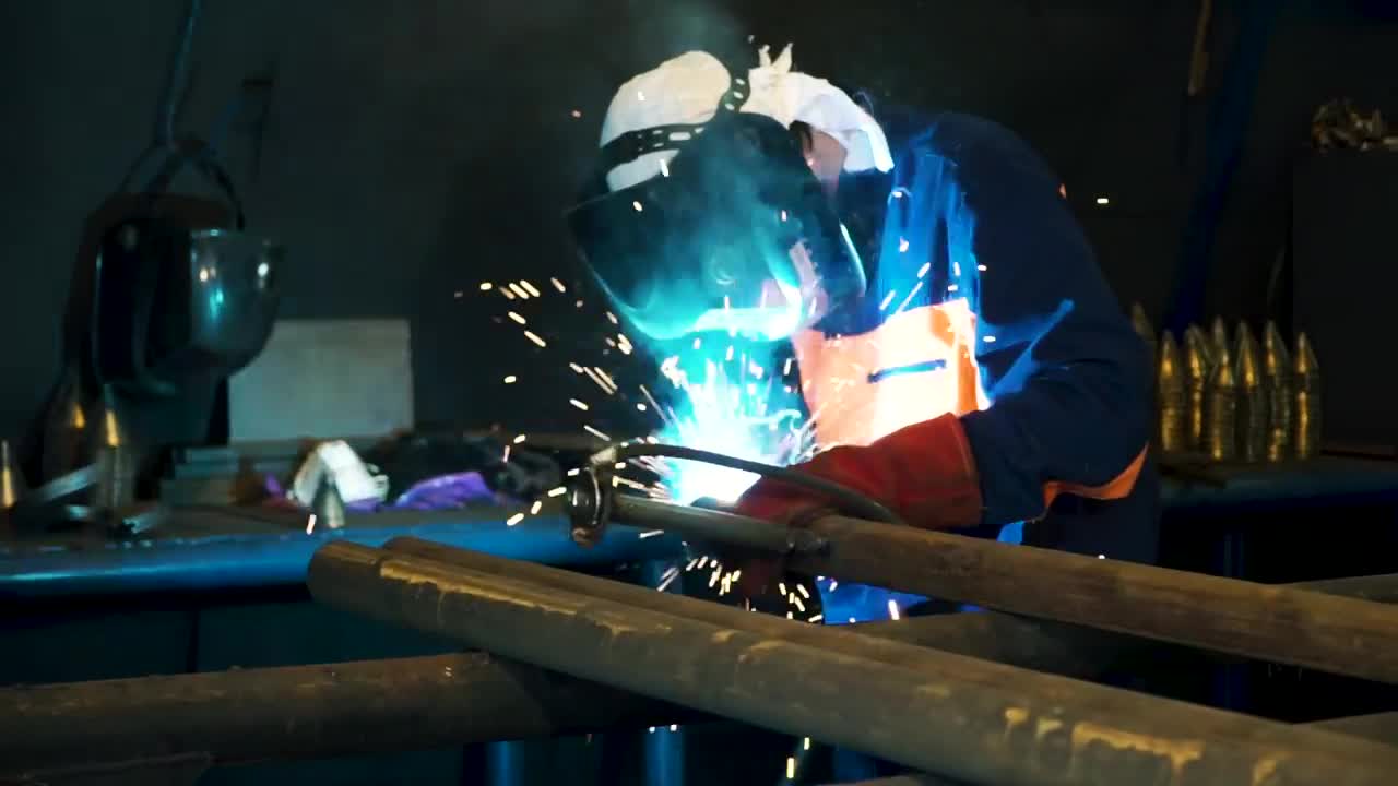   Stock Footage Welding By Hand In A Workshop Live Wallpaper