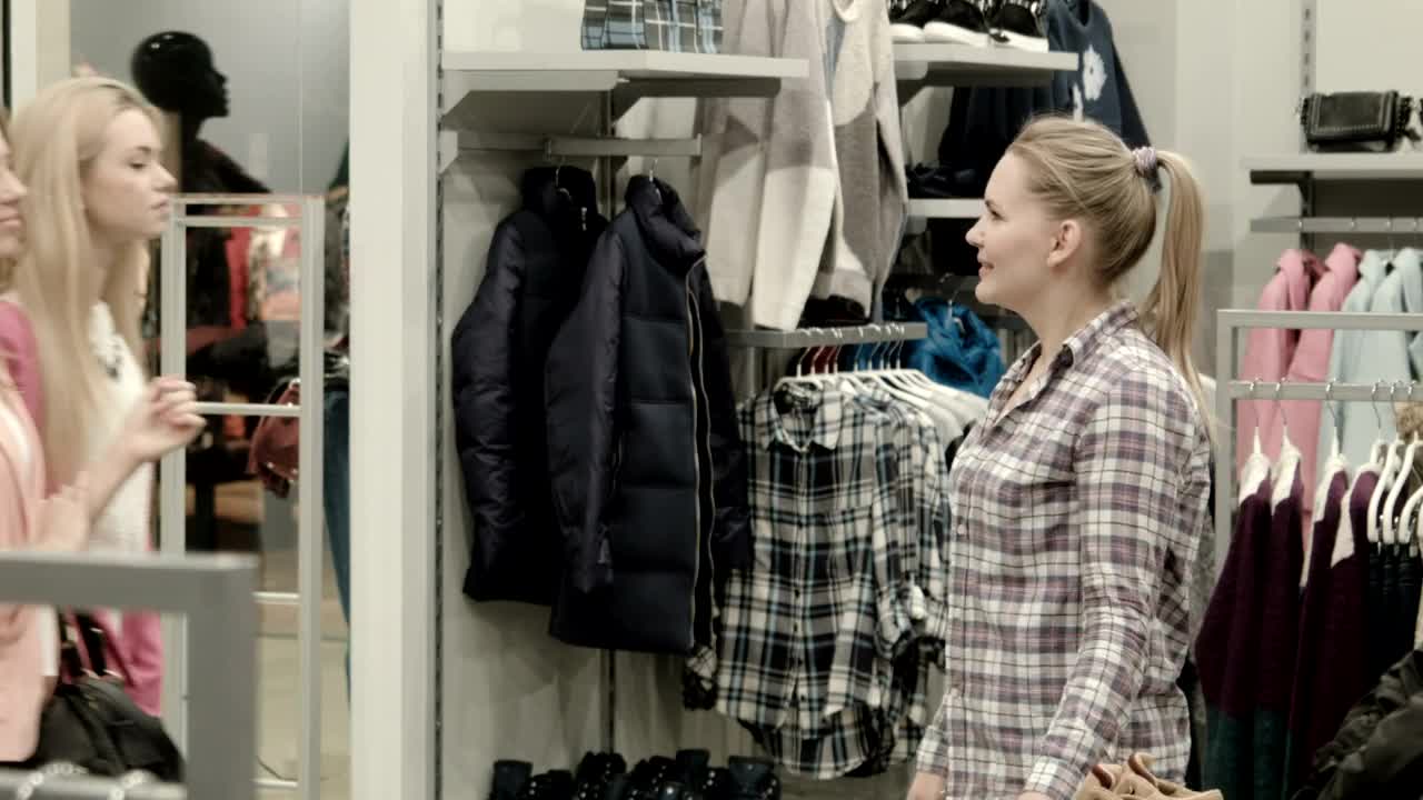   Stock Footage Welcoming Customers In Clothing Shop Live Wallpaper