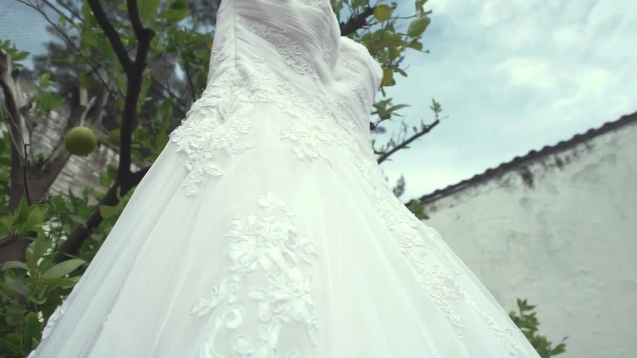   Stock Footage Wedding Dress Hanging On A Tree Live Wallpaper