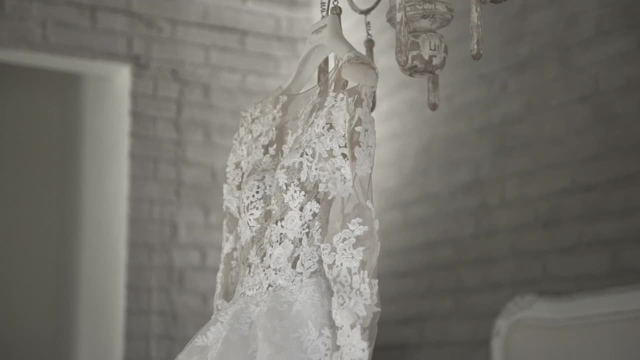   Stock Footage Wedding Dress Hanging On A Chandelier Live Wallpaper
