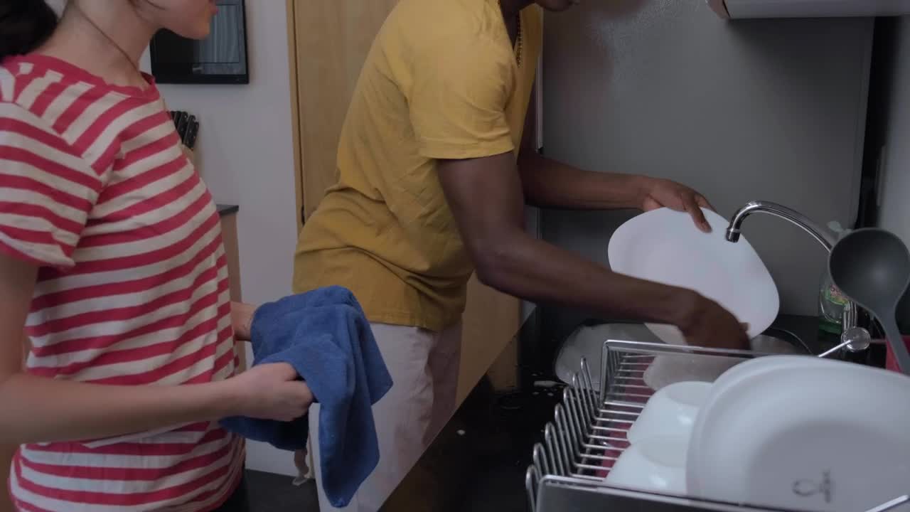   Stock Footage Wedding Couple Playing While Doing The Dishes Live Wallpaper
